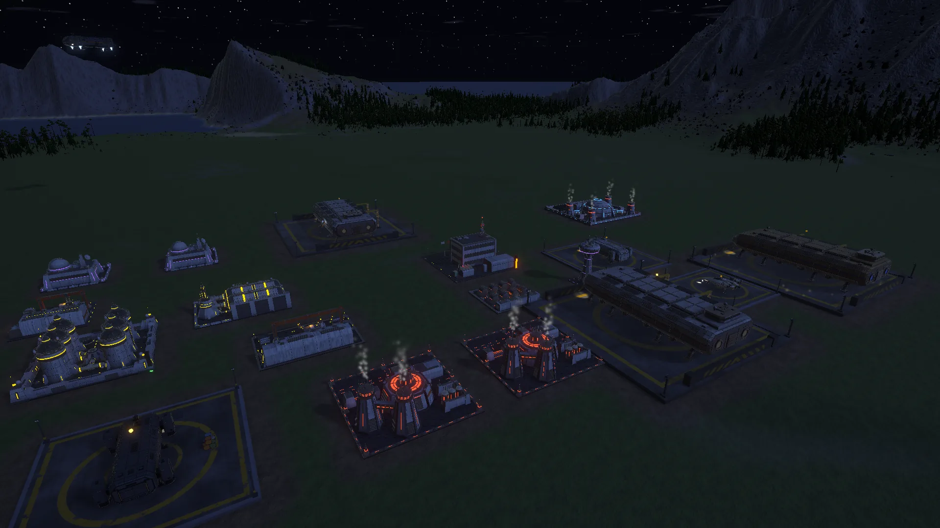 Starport Frontier at night: pad lights and lit buildings